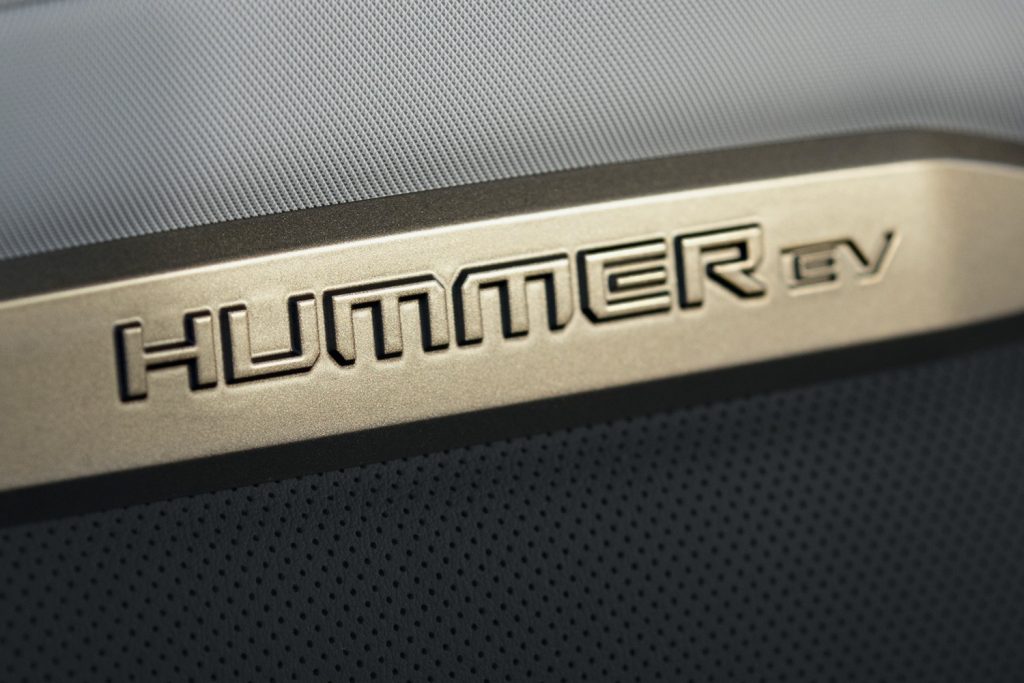 2022 GMC Hummer EV Pickup - Edition 1 - Interior 016 - Hummer EV logo on front seat