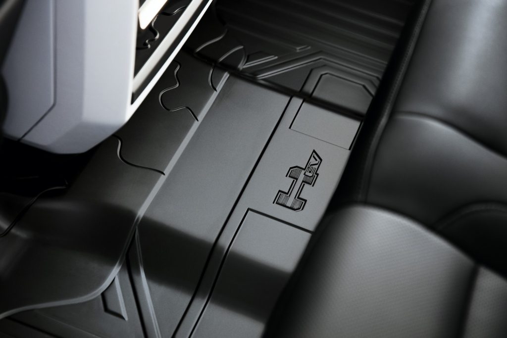 2022 GMC Hummer EV Pickup - Edition 1 - Interior 022 - HEV script logo on rear floor
