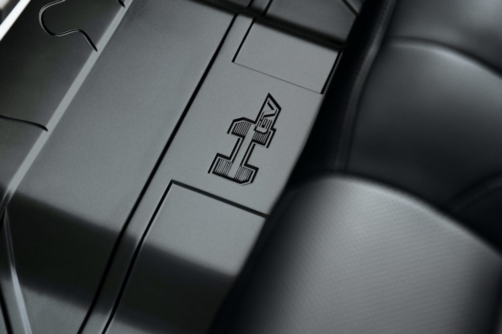 2022 GMC Hummer EV Pickup - Edition 1 - Interior 023 - HEV script logo on rear floor